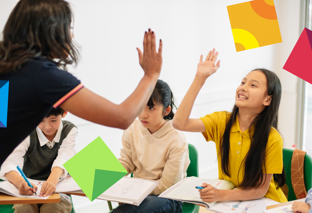 teacher high fiving young chinese students