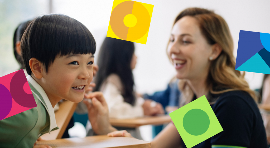 foreign teacher working with a chinese young learner and laughing together