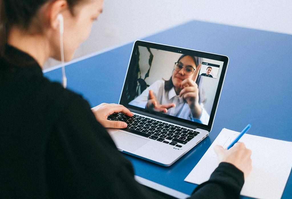 Lady on computer making notes